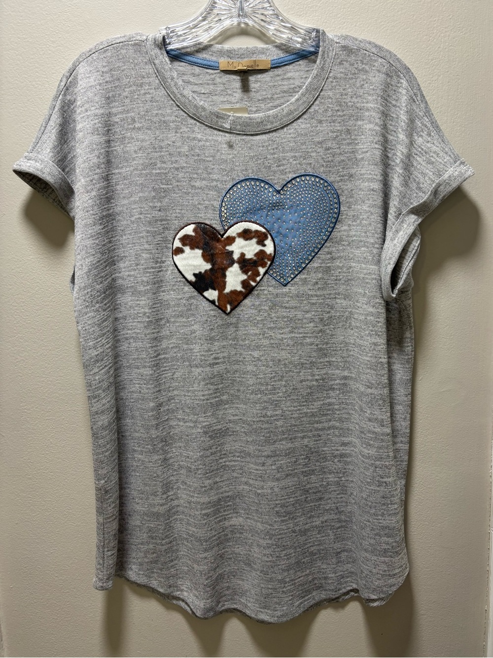 Woman’s medium My Danielle gray short sleeve top features double-heart graphic